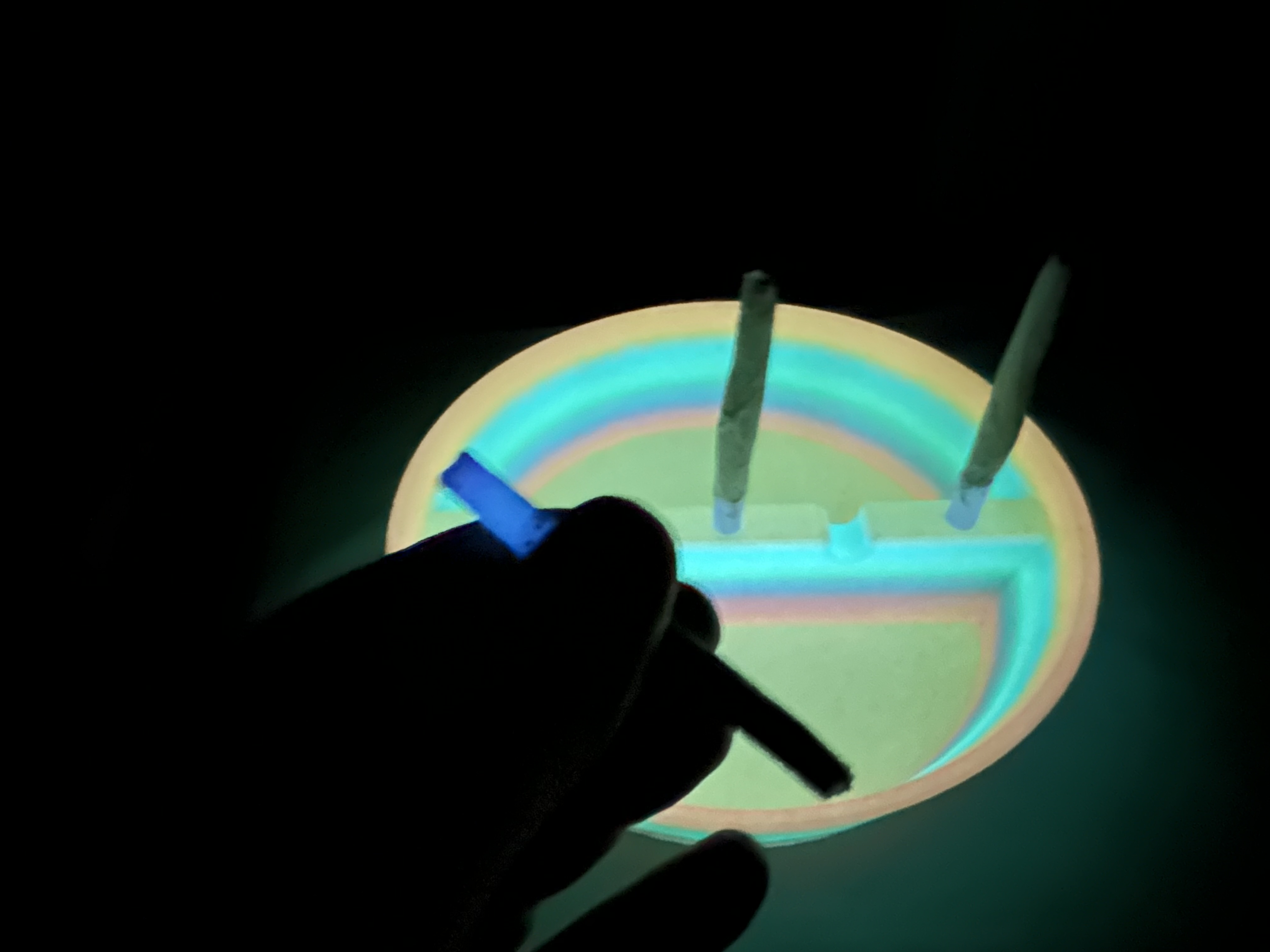 Rolling Tips ash tray glowing in the dark with loaded tips